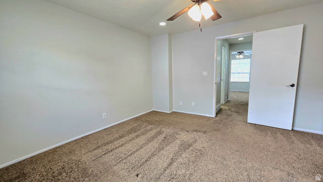 8732 Fairoaks Circle Sandy, UT 84070 - Photo 12 of 18 Unfurnished bedroom with carpet, recessed lighting, and a ceiling fan