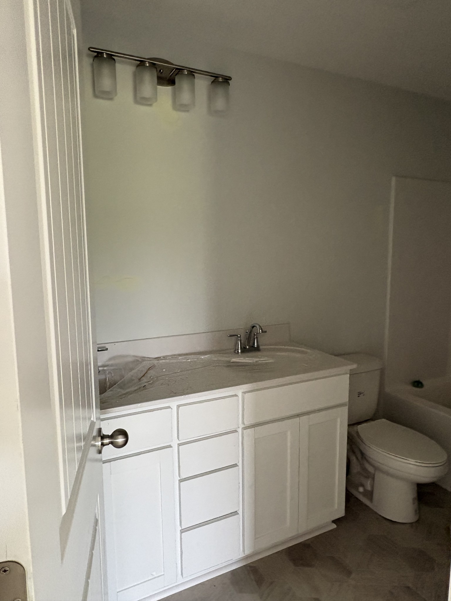 602 Ruby Cate Way Murfreesboro, TN 37128 - Photo 14 of 20 a bathroom with a granite countertop sink toilet and shower