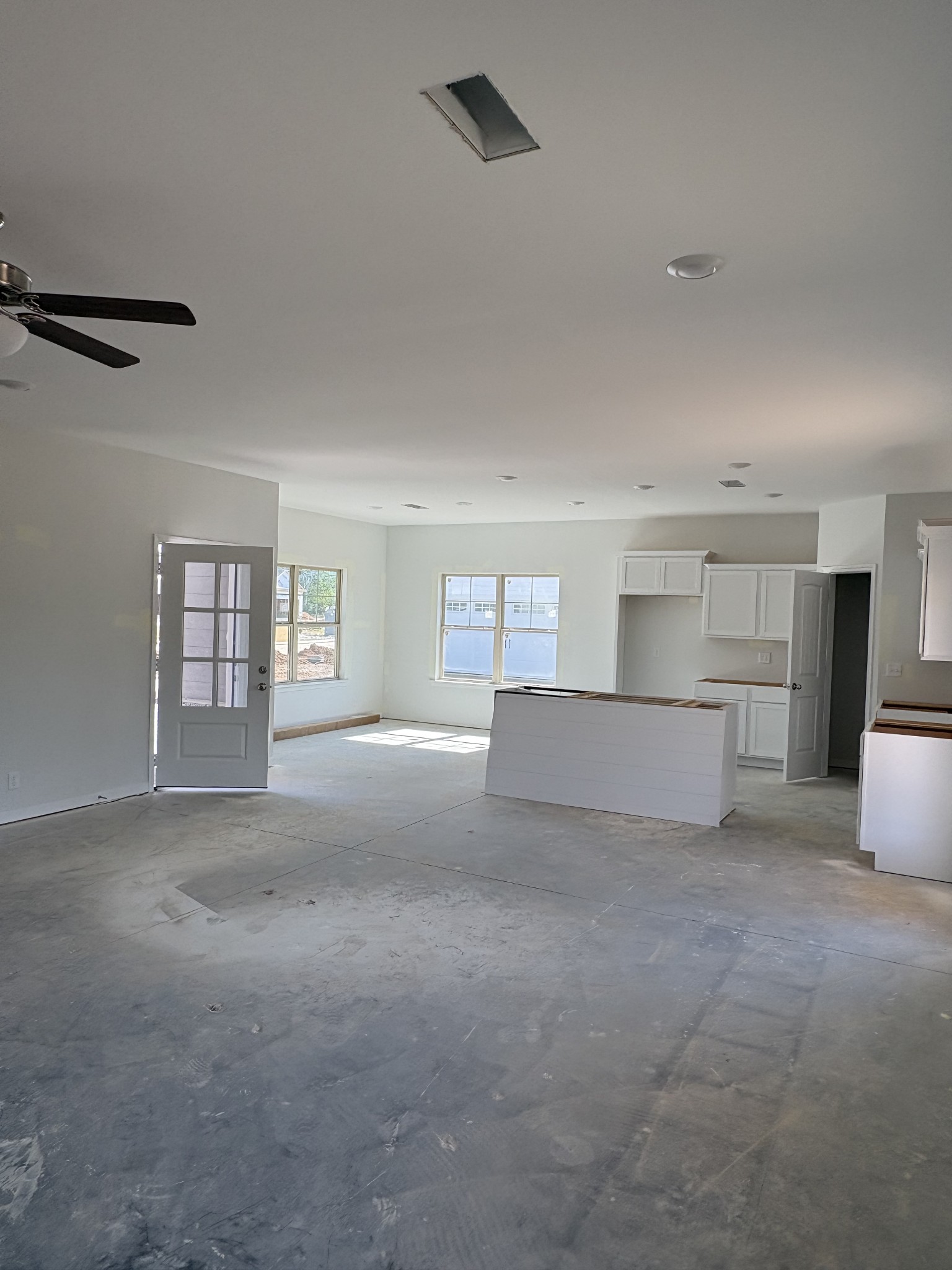 602 Ruby Cate Way Murfreesboro, TN 37128 - Photo 9 of 20 a view of an empty room with a kitchen