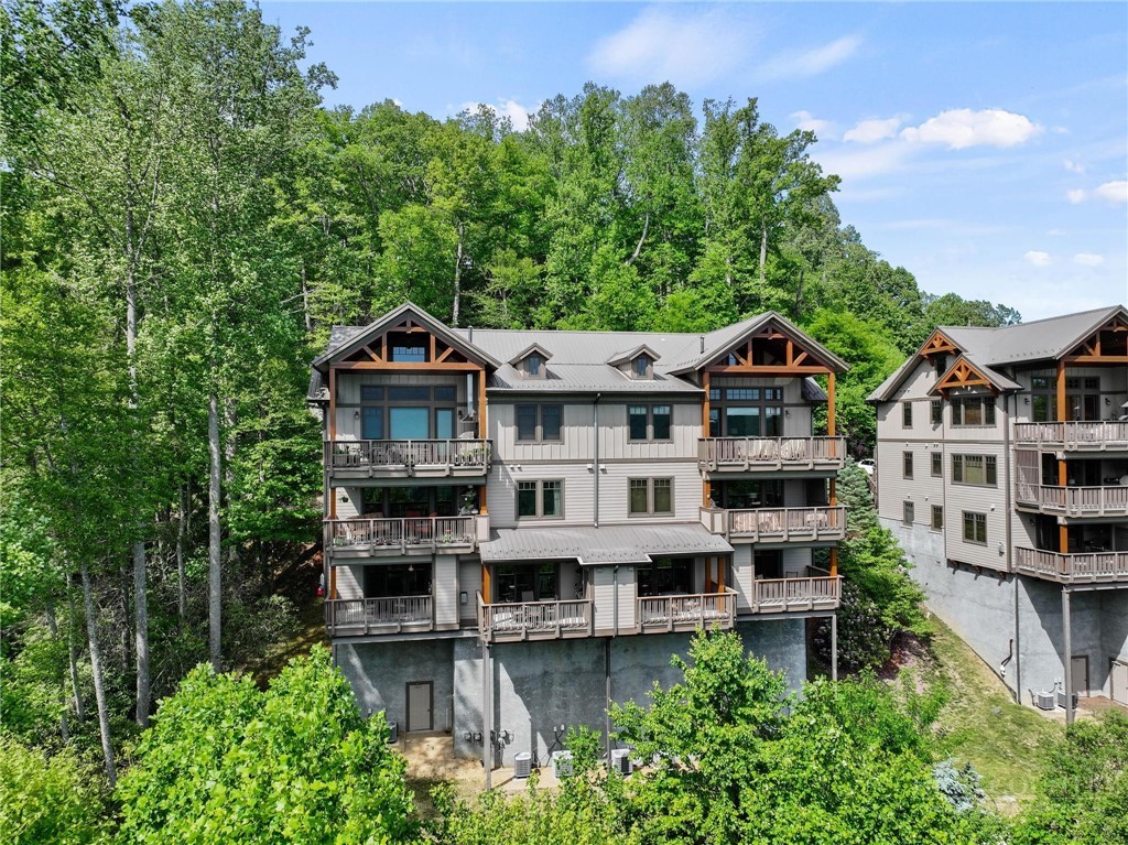 142 Evening View Lane, Unit CA3 Boone, NC 28607 - Photo 2 of 41 an aerial view of a house with balcony and trees al around