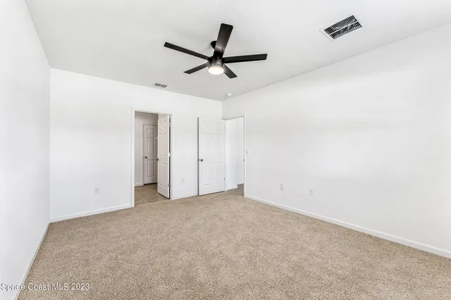a bathroom with a double vanity sink and mirror