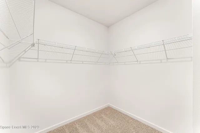 a view of a kitchen with a sink and a living room