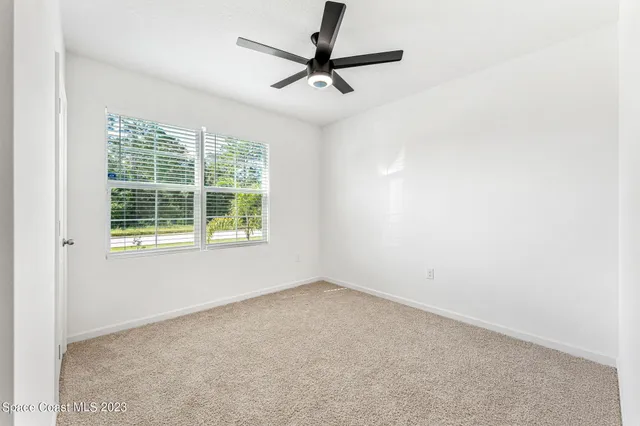 wooden floor with white walls