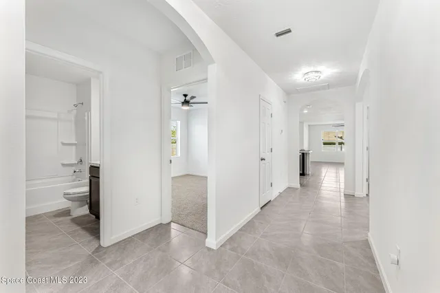 a view of a storage & utility room with a sink