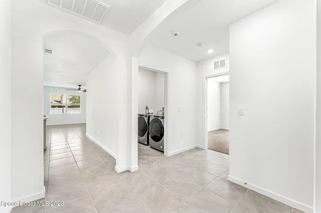 a view of an empty room with a window