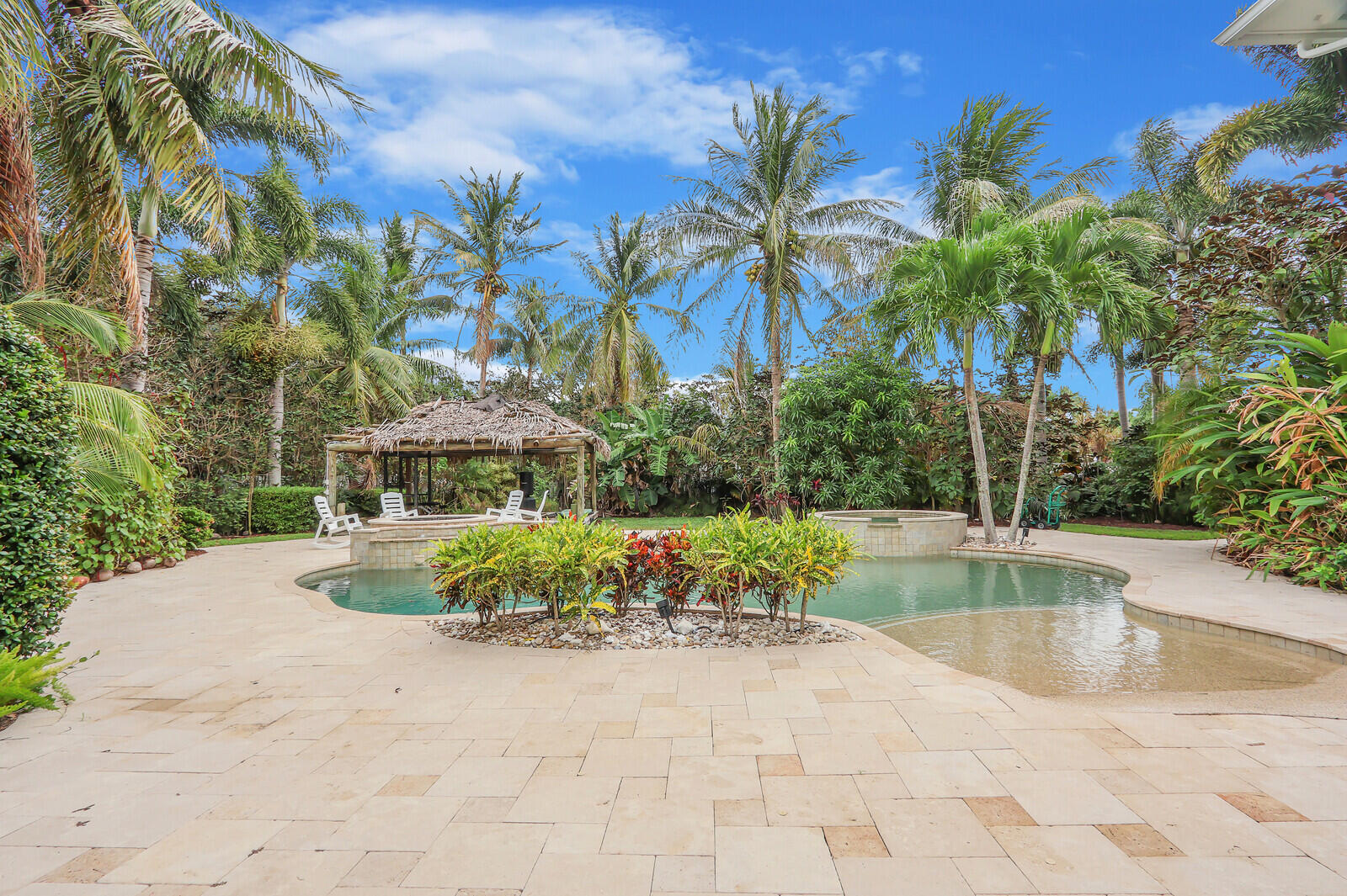 101 St Pierre Way Jupiter, FL 33458 - Photo 53 of 57 a view of a backyard with palm trees