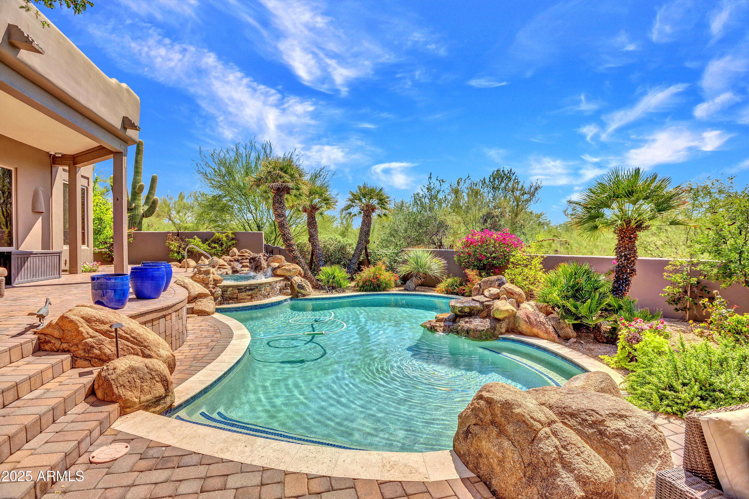 10040 East Happy Valley Road, Unit 268 Scottsdale, AZ 85255 - Photo 1 of 40 a view of a backyard with sitting area