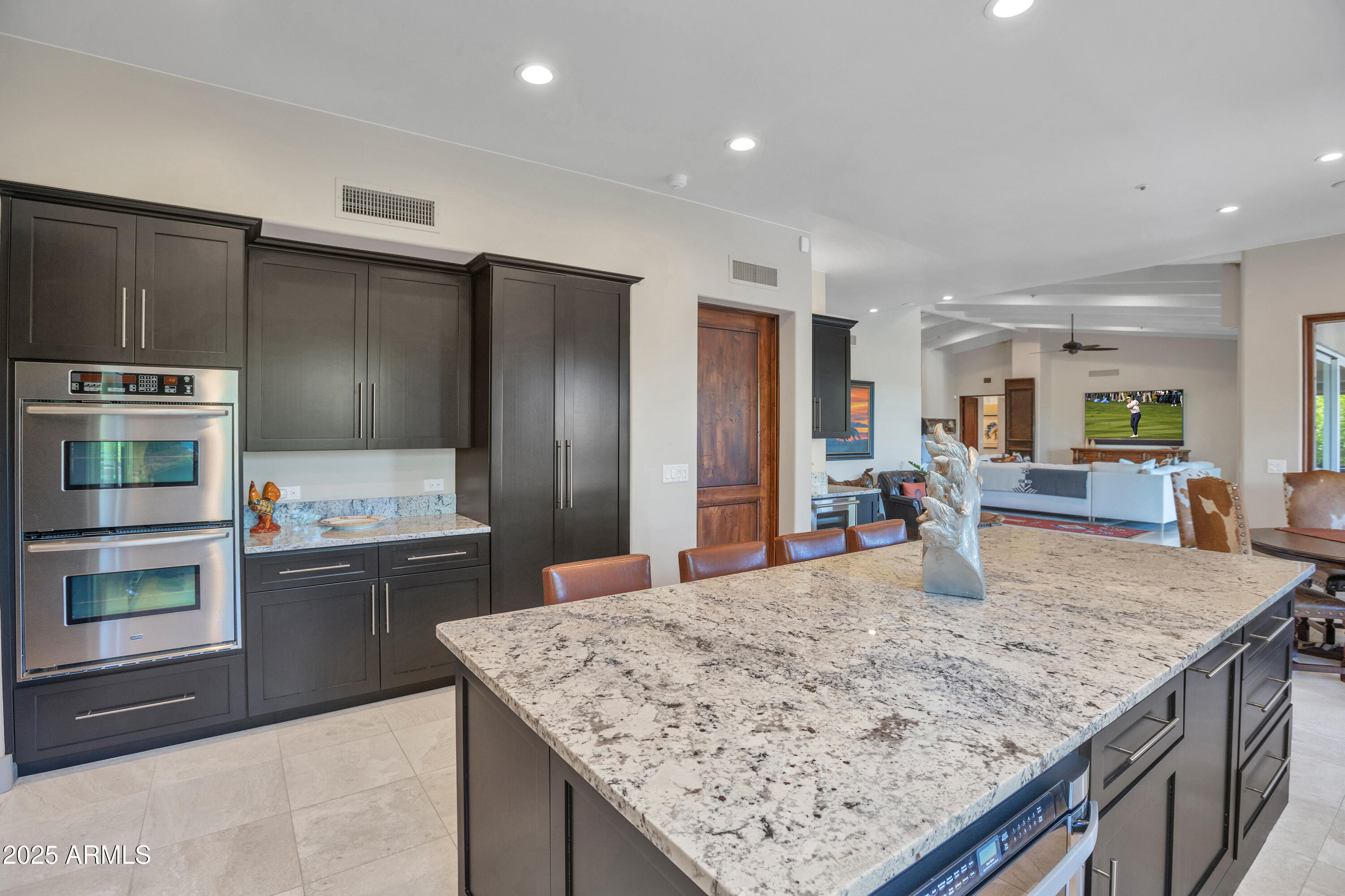 10040 East Happy Valley Road, Unit 268 Scottsdale, AZ 85255 - Photo 13 of 40 a kitchen with stainless steel appliances granite countertop granite counter tops and a refrigerator