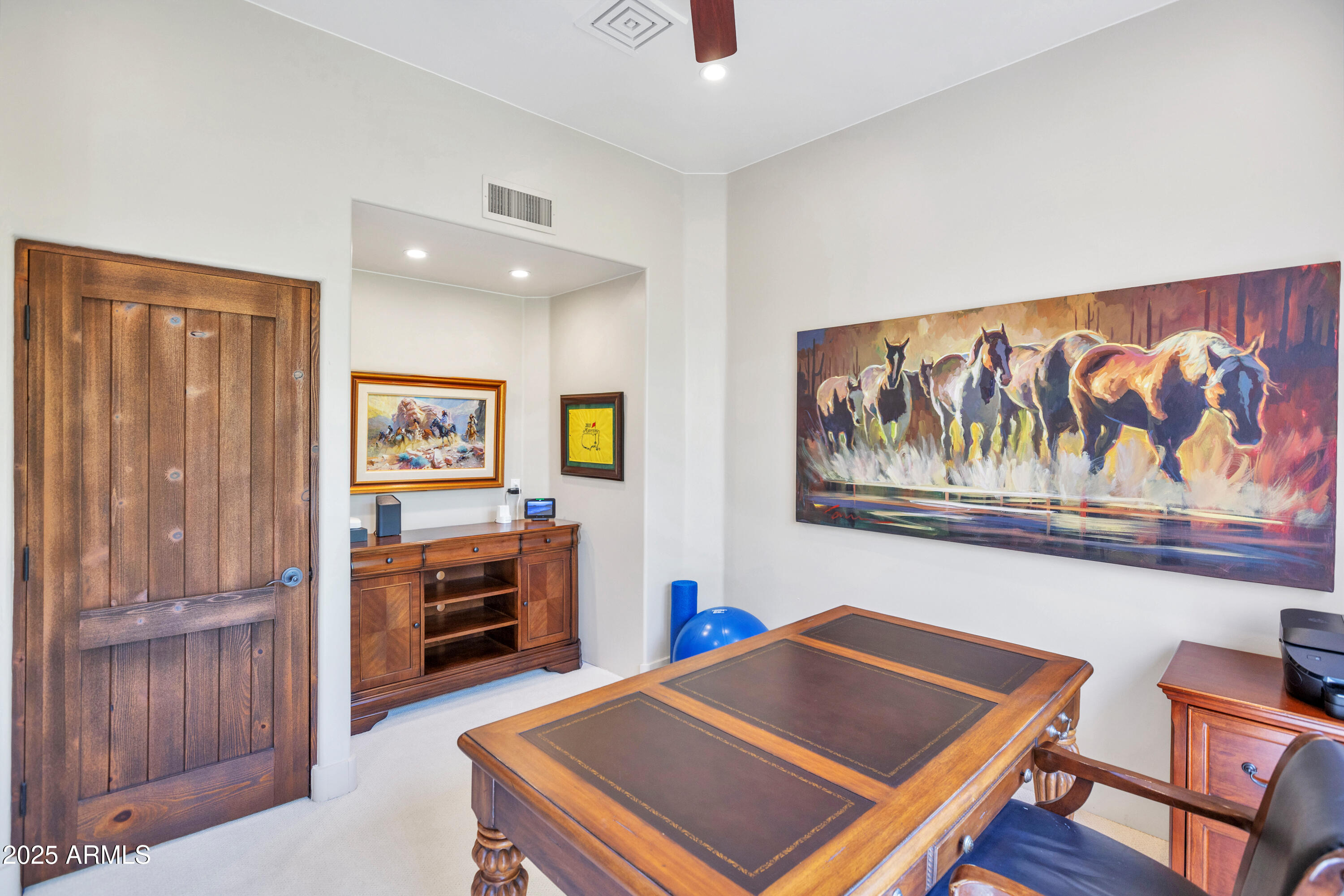 10040 East Happy Valley Road, Unit 268 Scottsdale, AZ 85255 - Photo 20 of 40 a room with furniture and paintings on the wall