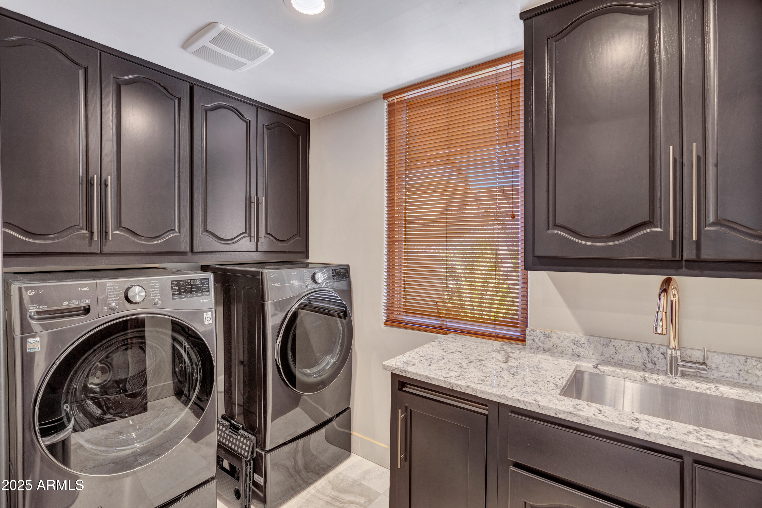 10040 East Happy Valley Road, Unit 268 Scottsdale, AZ 85255 - Photo 29 of 40 a utility room with a sink a washer and dryer