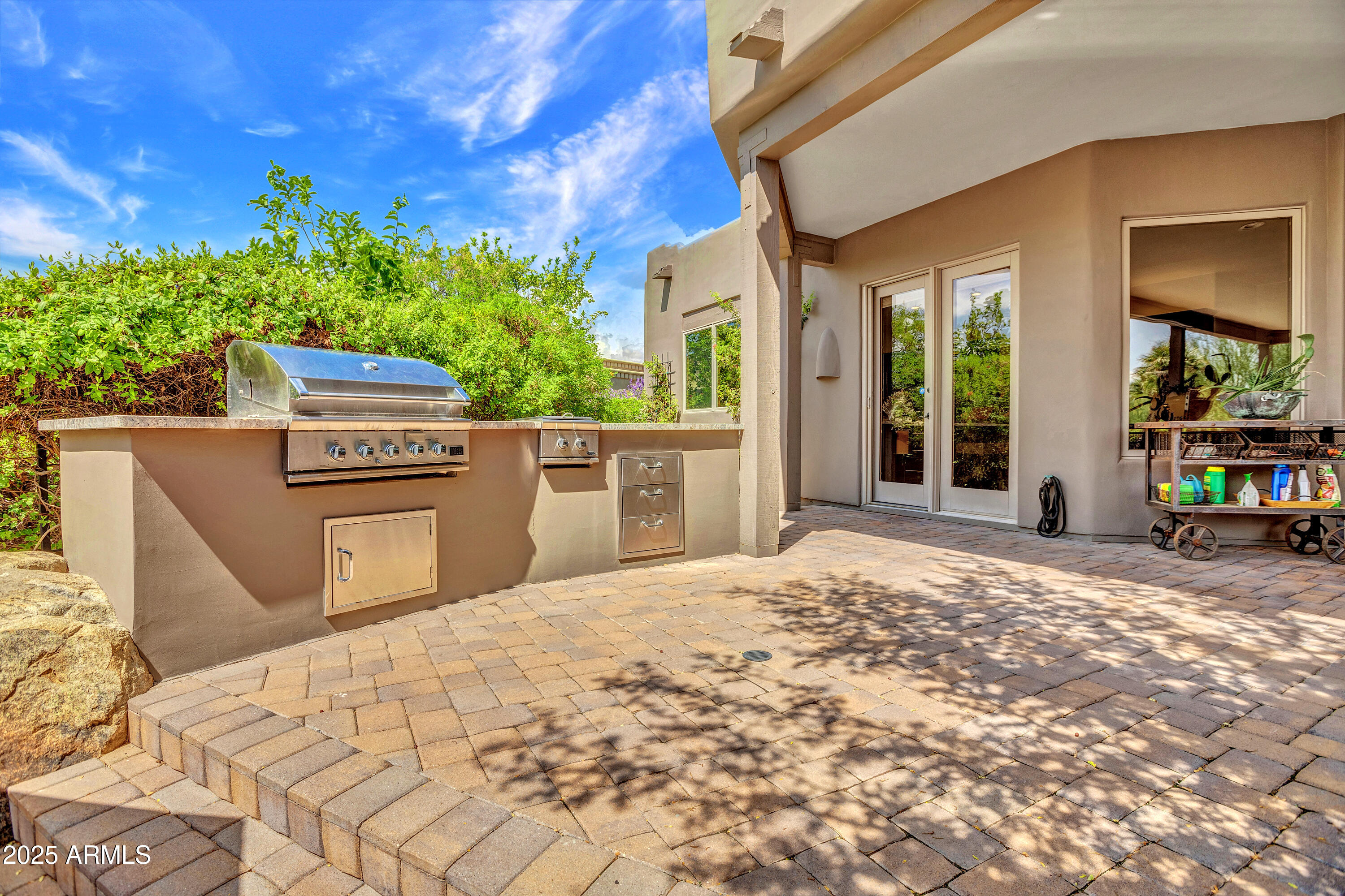 10040 East Happy Valley Road, Unit 268 Scottsdale, AZ 85255 - Photo 33 of 40 a view of a house with a backyard