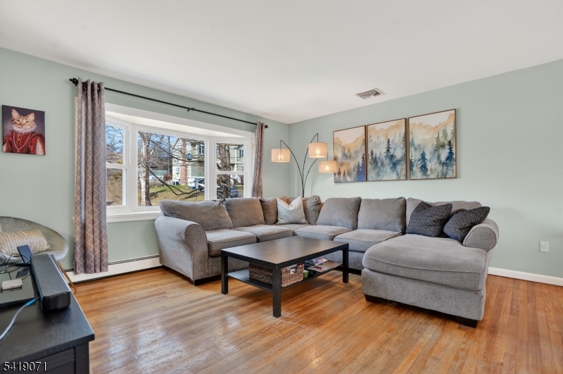 116 Star Lake Road Bloomingdale, NJ 07403 - Photo 21 of 24 a living room with furniture and a large window