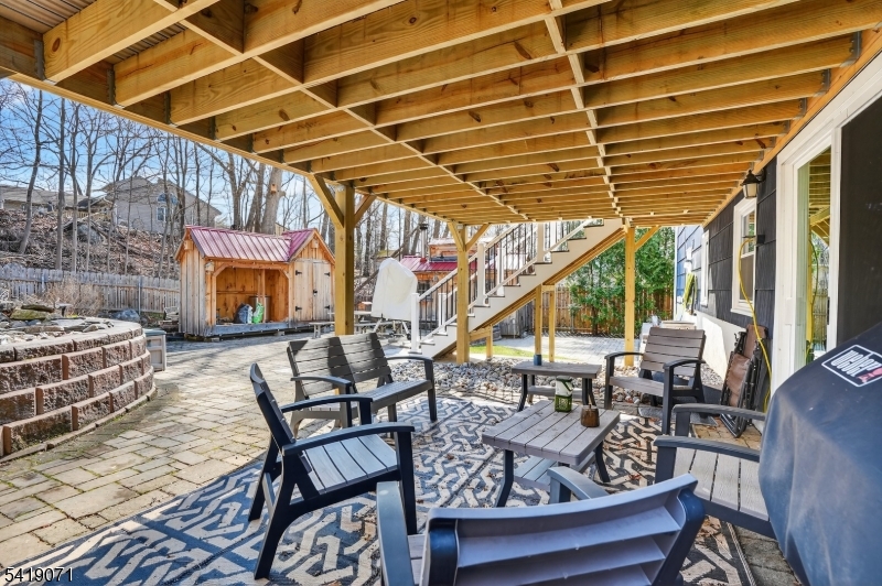 116 Star Lake Road Bloomingdale, NJ 07403 - Photo 23 of 24 a view of a patio with table and chairs and potted plants
