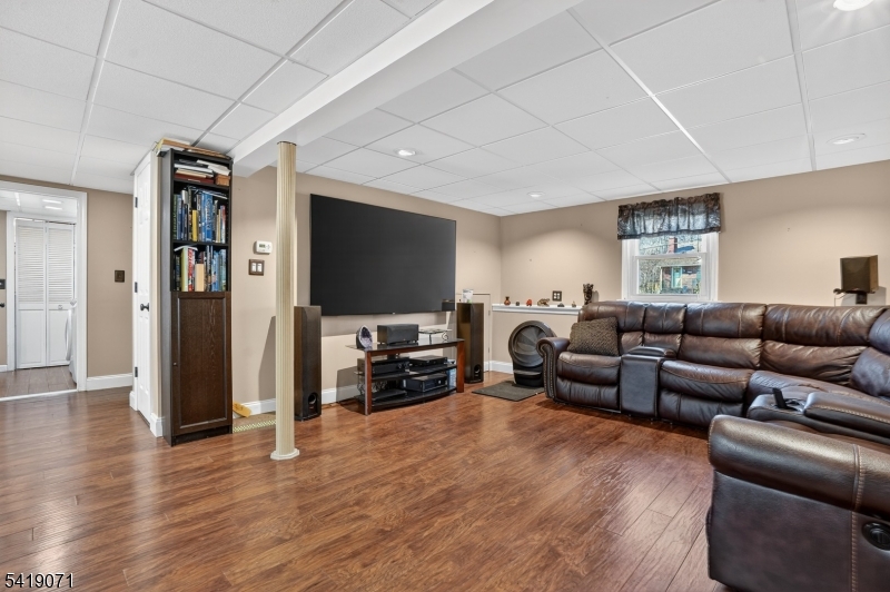 116 Star Lake Road Bloomingdale, NJ 07403 - Photo 4 of 24 a living room with furniture and a flat screen tv