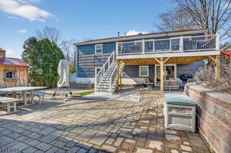 116 Star Lake Road Bloomingdale, NJ 07403 - Photo 5 of 24 a view of a brick house with many windows