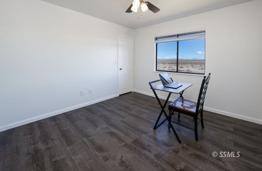 224 Richard Court Ridgecrest, CA 93555 - Photo 27 of 49 a view of a room with wooden floor air conditioner and windows