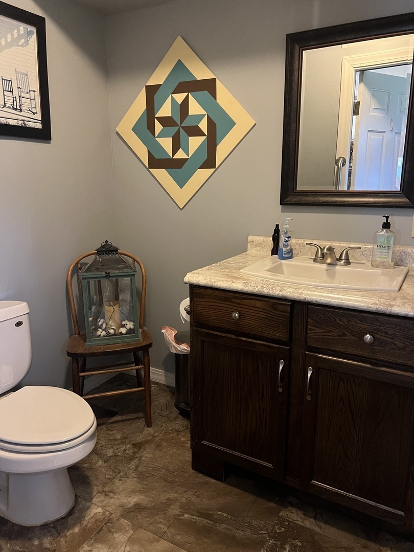9843 Hoover Road Rock Falls, IL 61071 - Photo 10 of 23 a bathroom with a toilet a sink and mirror