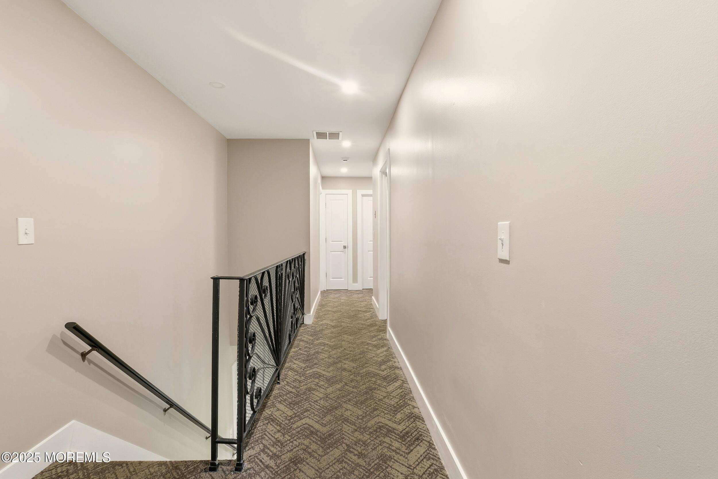 2930 Highway 9 Howell, NJ 07731 - Photo 12 of 30 a view of a hallway with wooden floor and staircase