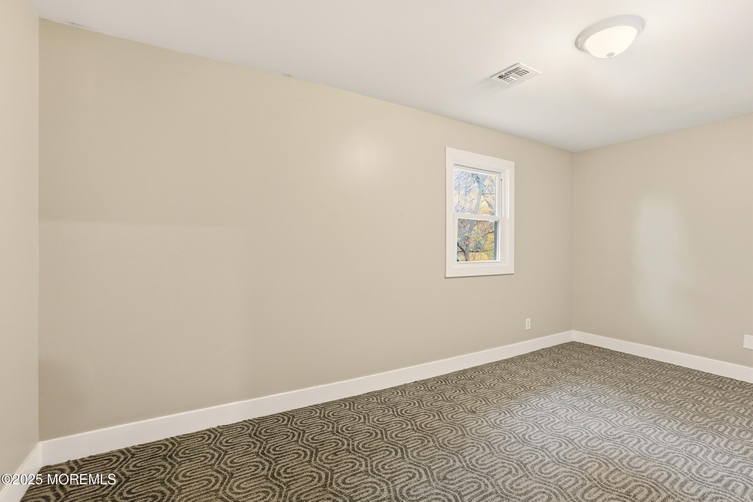 2930 Highway 9 Howell, NJ 07731 - Photo 17 of 30 an empty room with a window