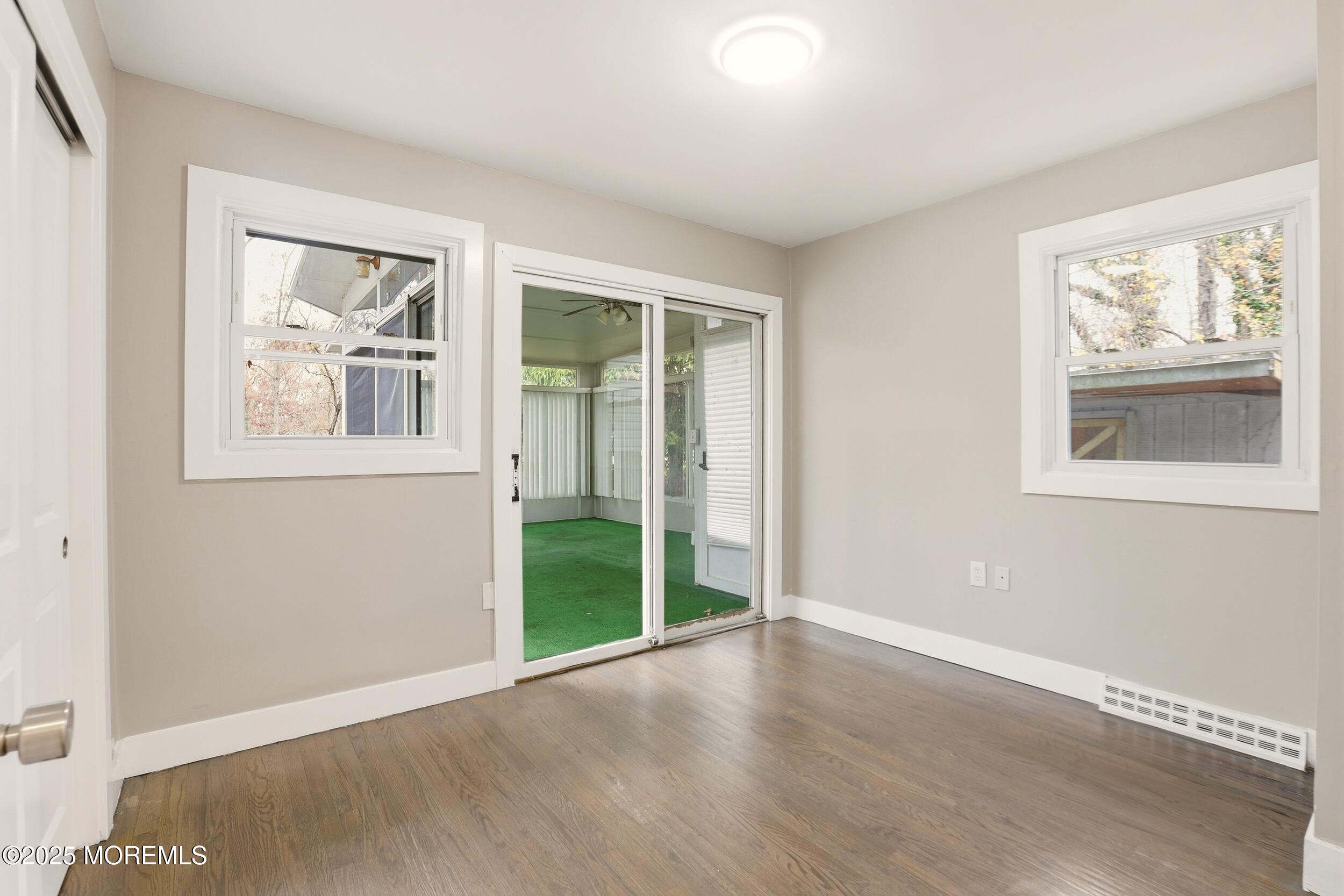 2930 Highway 9 Howell, NJ 07731 - Photo 23 of 30 an empty room with wooden floor and a window