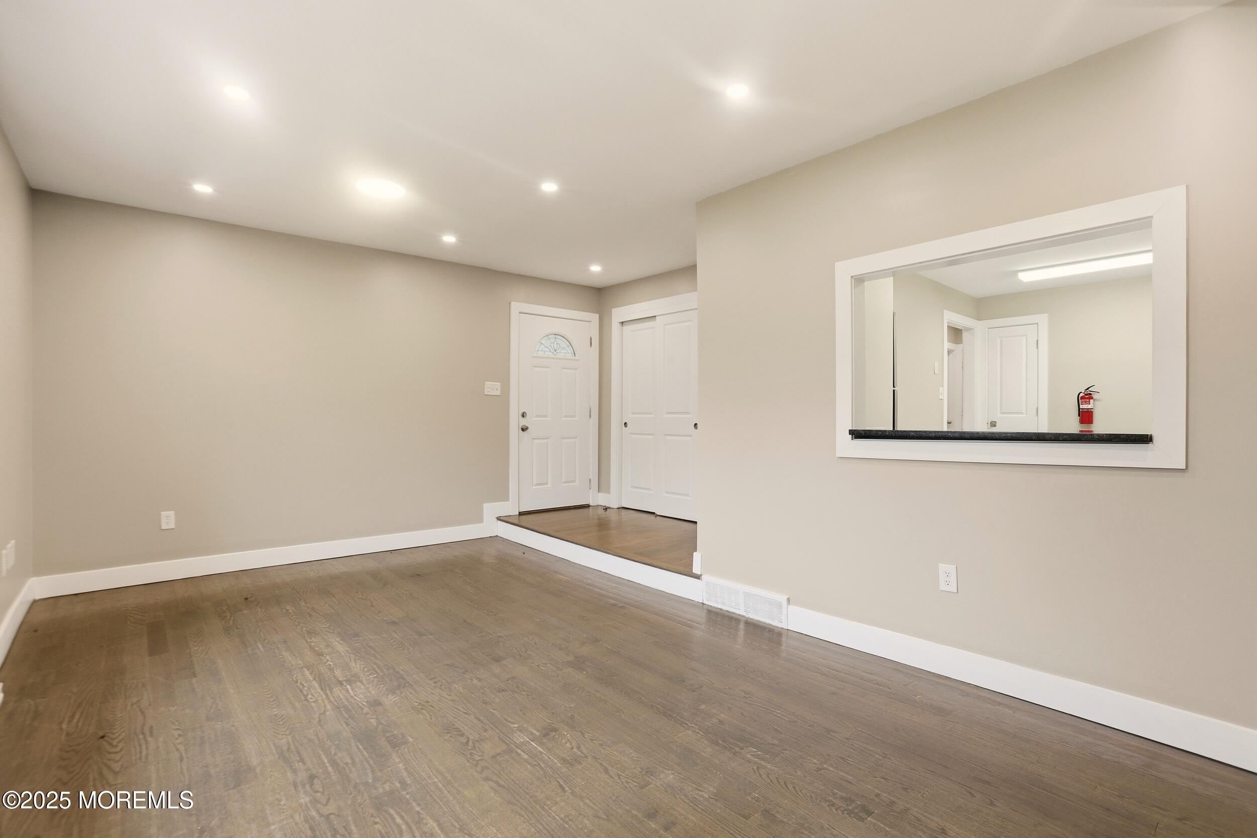 2930 Highway 9 Howell, NJ 07731 - Photo 4 of 30 an empty room with a mirror and vanity