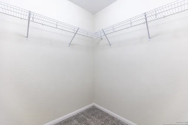 a view of a room with racks on the wall