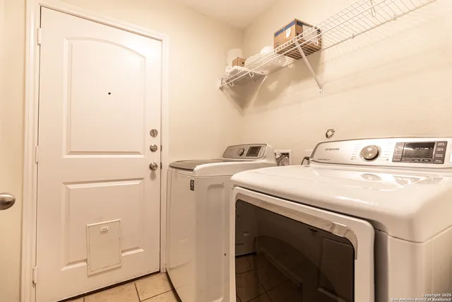 a utility room with dryer and washer