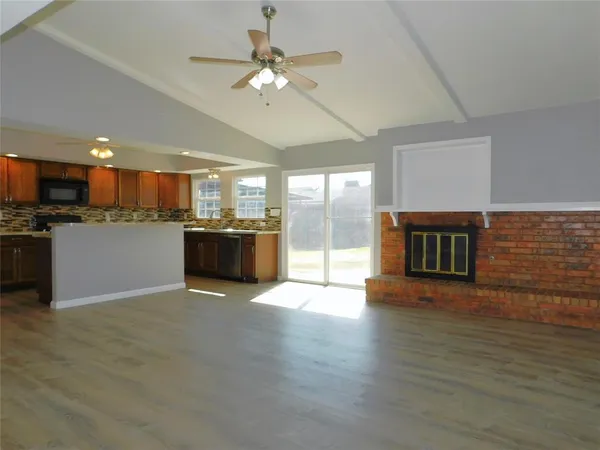a view of a kitchen with a sink and a microwave