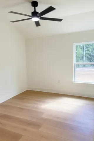 a spacious bathroom with a double vanity sink a mirror and bathtub