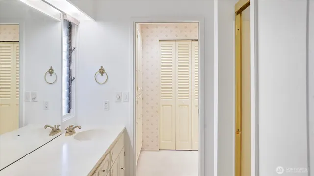 a view of a bathroom from a hallway
