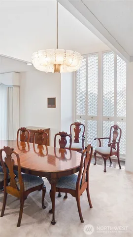 a view of a dining room with furniture window and outside view