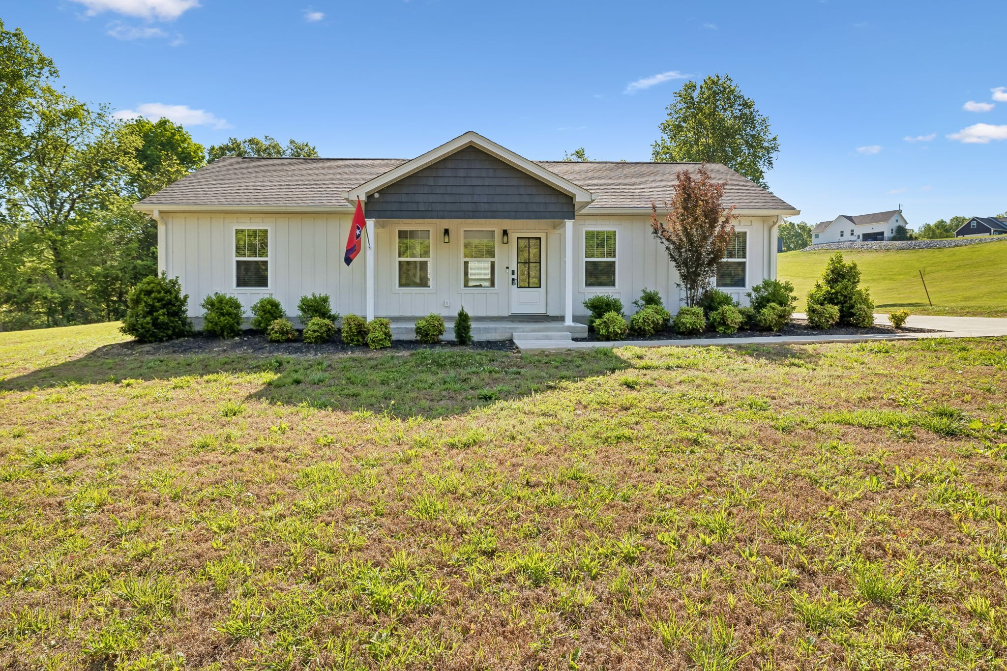 a view of a house with garden and yard