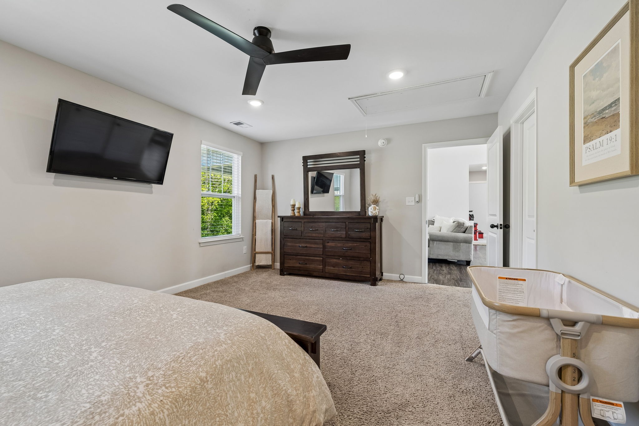 300 Still Point Road Smithville, TN 37166 - Photo 21 of 40 a spacious bedroom with a bed and a flat screen tv