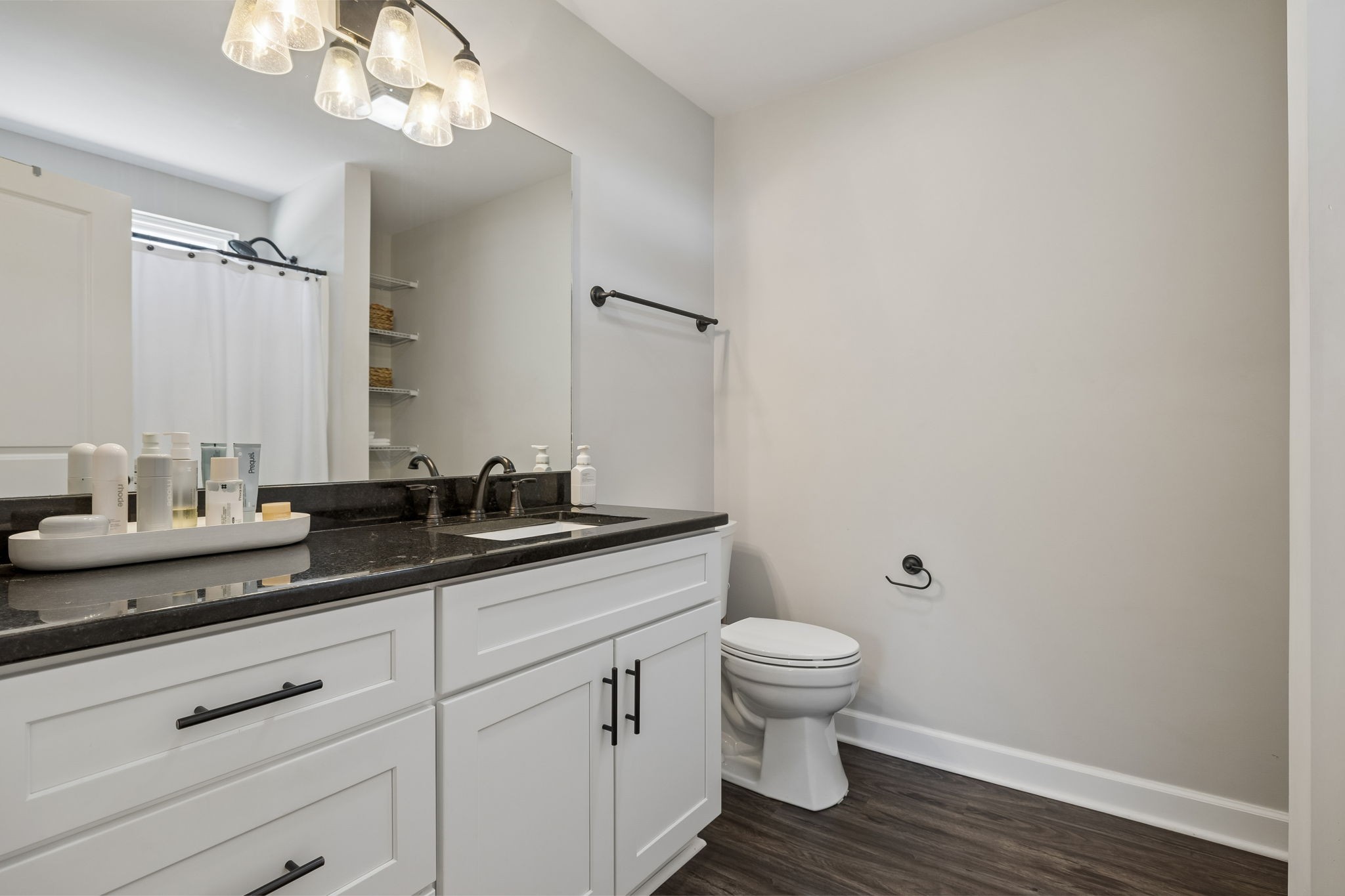300 Still Point Road Smithville, TN 37166 - Photo 22 of 40 a bathroom with a granite countertop sink a toilet and a mirror