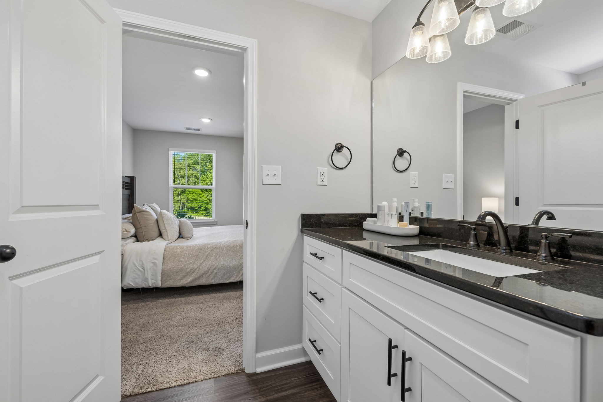 300 Still Point Road Smithville, TN 37166 - Photo 23 of 40 a en suite bathroom with double sink and a mirror