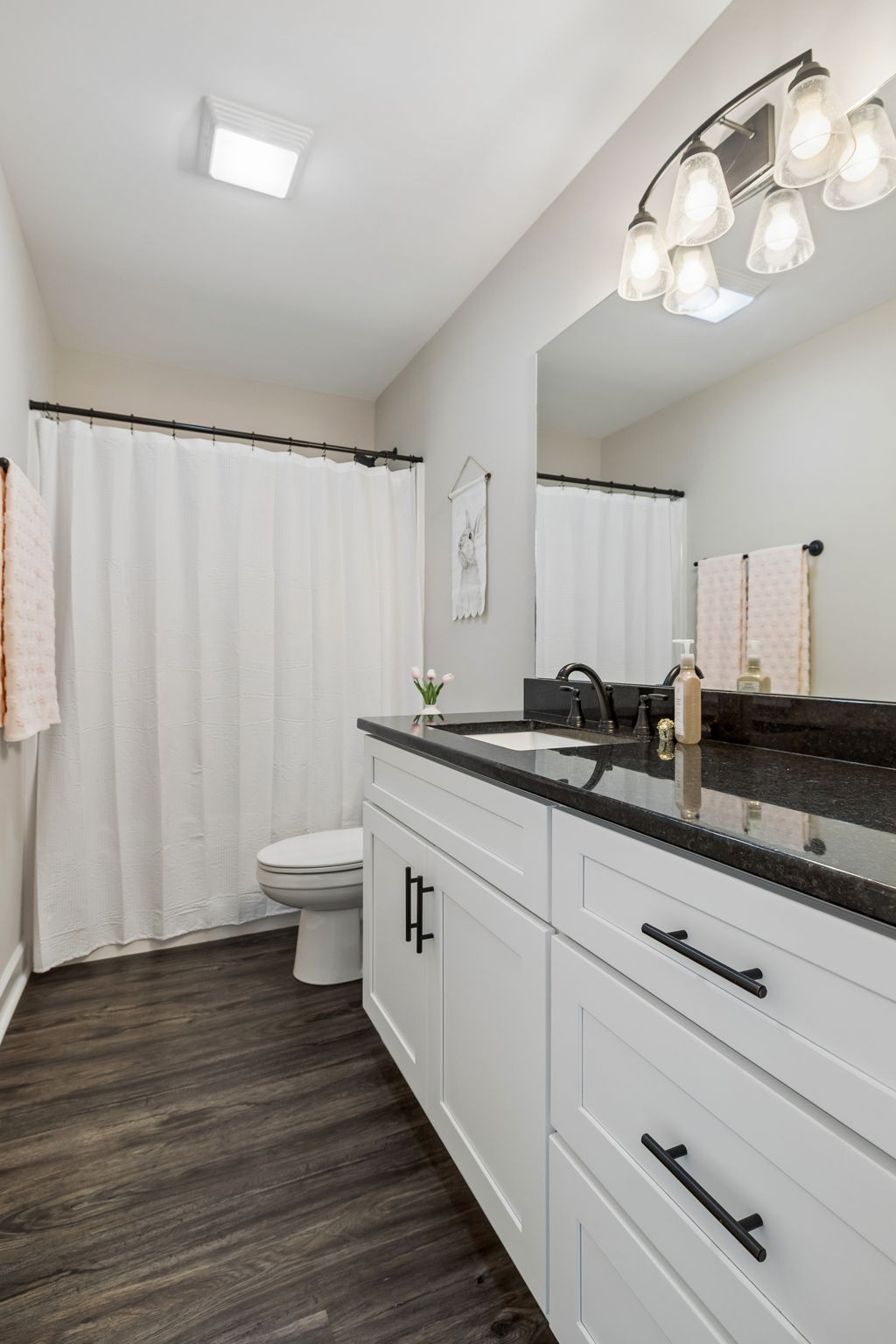 300 Still Point Road Smithville, TN 37166 - Photo 26 of 40 a bathroom with a double vanity sink and a mirror