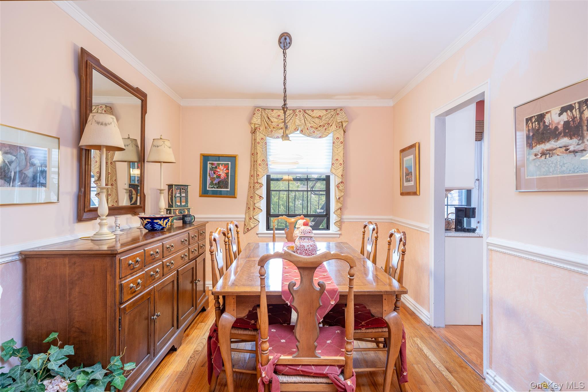 180 Garth Road, Unit 5F Scarsdale, NY 10583 - Photo 11 of 26 a view of a dining room with furniture window and wooden floor