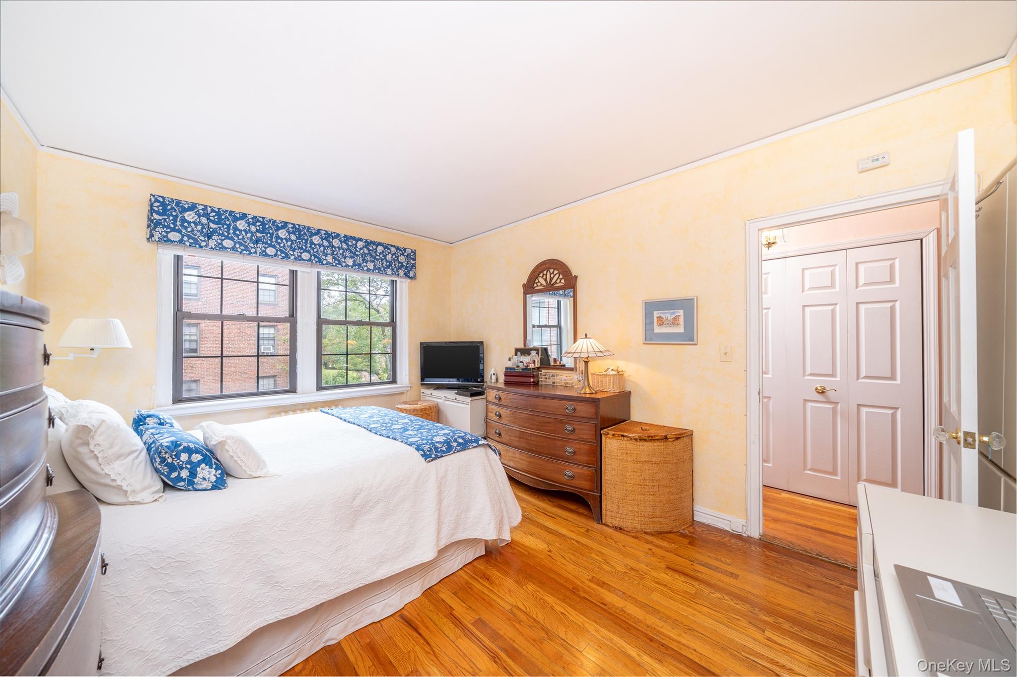 180 Garth Road, Unit 5F Scarsdale, NY 10583 - Photo 14 of 26 a bed room with a bed and a window