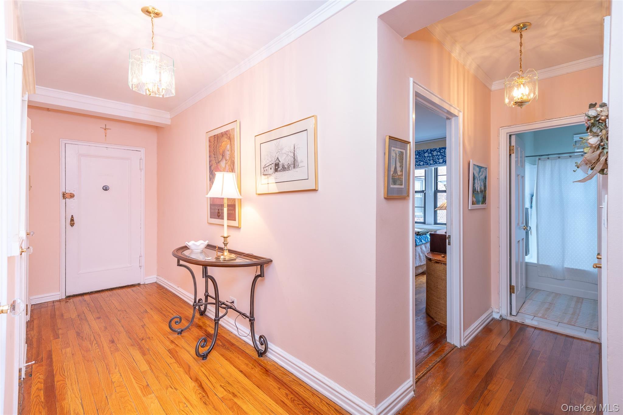 180 Garth Road, Unit 5F Scarsdale, NY 10583 - Photo 2 of 26 a view of a hallway with wooden floor and dining room