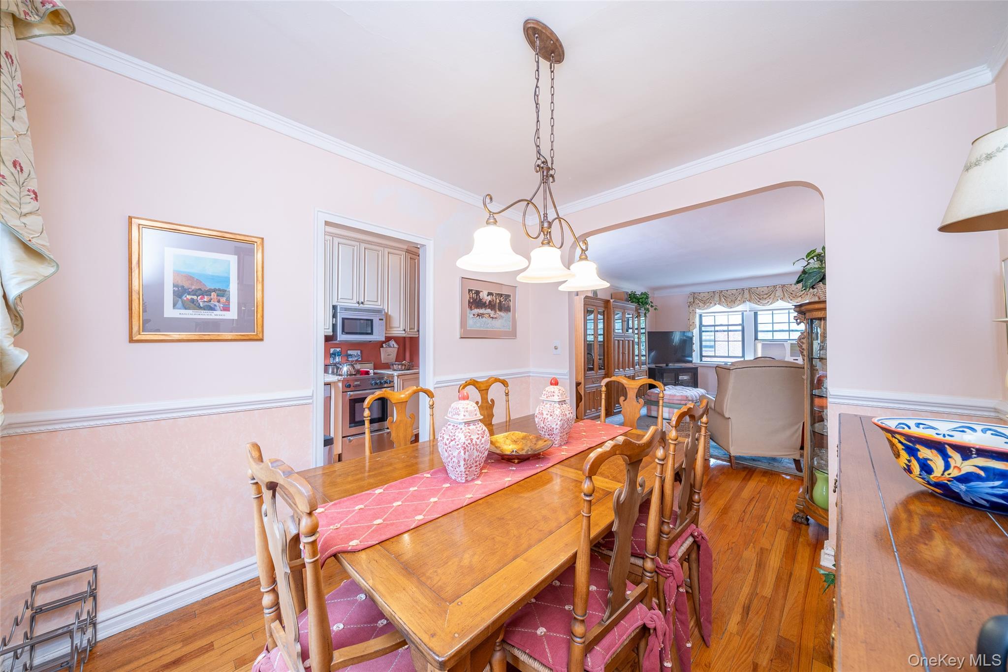 180 Garth Road, Unit 5F Scarsdale, NY 10583 - Photo 10 of 26 a dining room with furniture and window