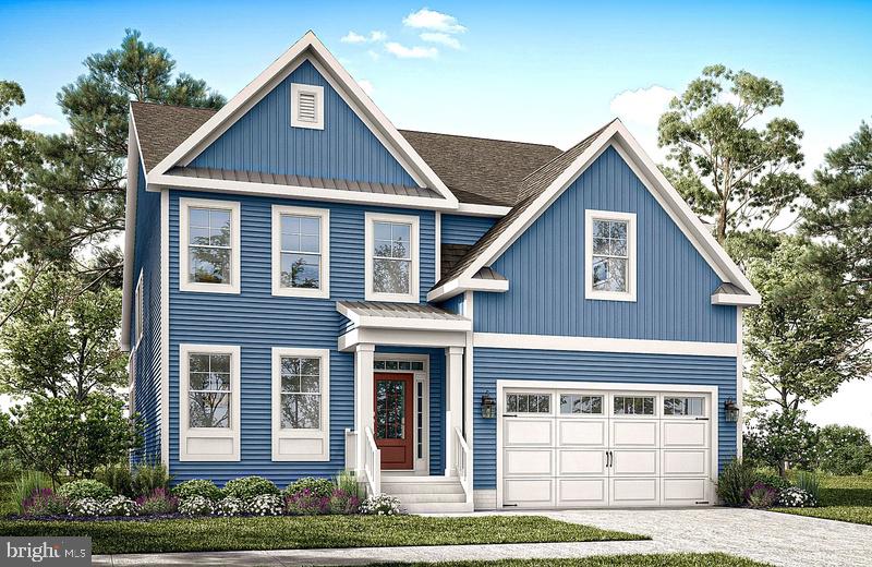 31753 Shoal Creek Lane Harbeson, DE 19951 - Photo 1 of 5 a front view of a house with garden