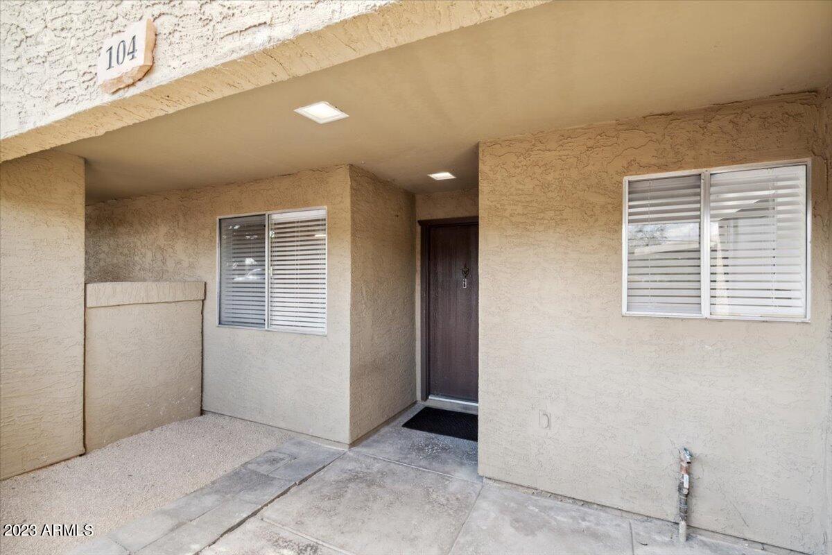 4050 East Cactus Road, Unit 104 Phoenix, AZ 85032 - Photo 25 of 29 Front entrance + Patio + Storage closet