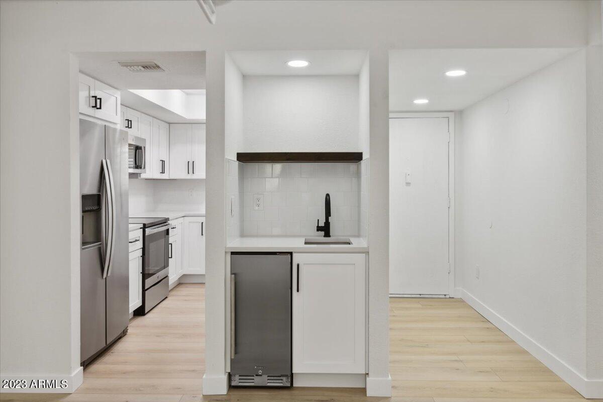 4050 East Cactus Road, Unit 104 Phoenix, AZ 85032 - Photo 8 of 29 Wet bar + Mini Fridge