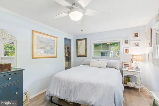 a bedroom with a bed and flat screen tv