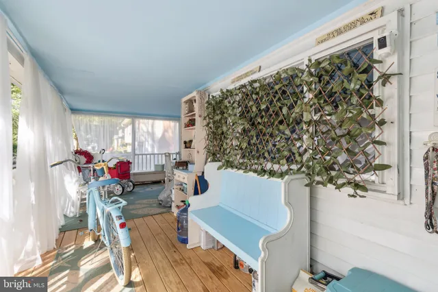 a backyard of a house with a yard and large trees