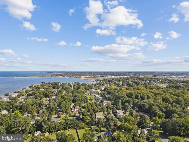 an aerial view of a house with a yard and garden