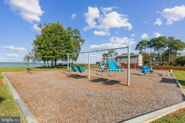 a swimming pool view with a seating space