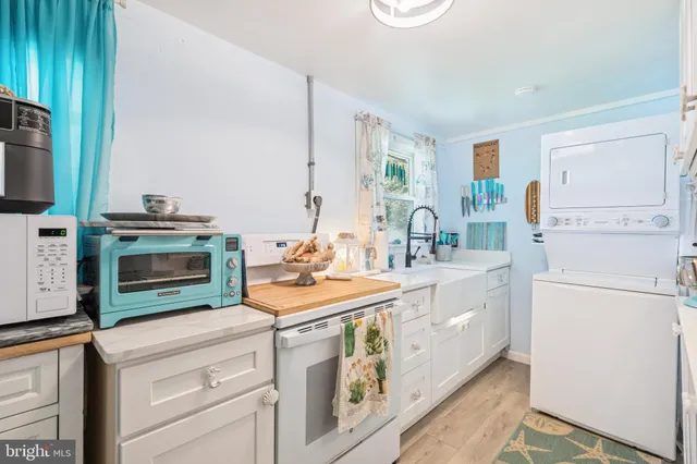 a view of a kitchen with furniture and a window