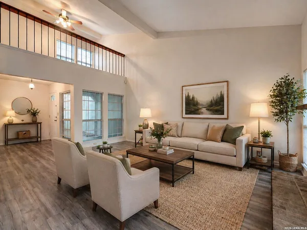 a living room with furniture and a large window
