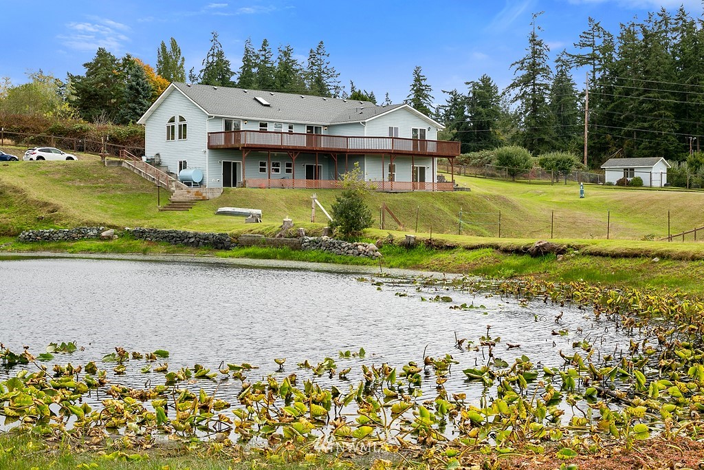 2075 East Goss Lake Road Freeland, WA 98249 - Photo 1 of 40 an aerial view of a house with a yard